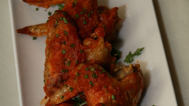 Portside Tavern’s Confit Chicken Wings in Harissa Sauce  