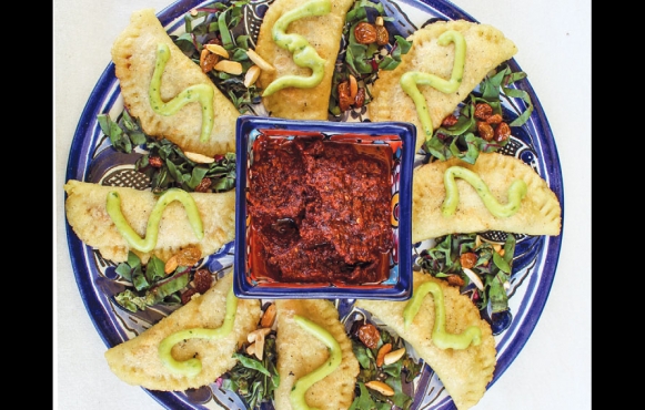 Vegan Veracruz empanadas with salsa.